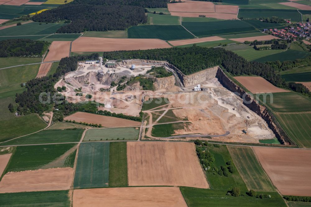 Aerial image Karlstadt - Quarry for the mining and handling of gravel of the Emil Vaeth GmbH Schotterwerk and Bauschuttrecycling Am Schotterwerk in Karlstadt in the state Bavaria, Germany