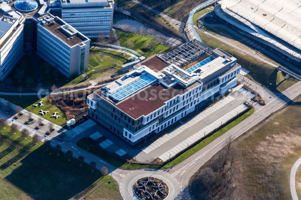 Walldorf from the bird's eye view: Star-shaped office buildings of the SAP Deutschland SE & Co. KG at the forest edged in Walldorf in the state Baden-Wuerttemberg