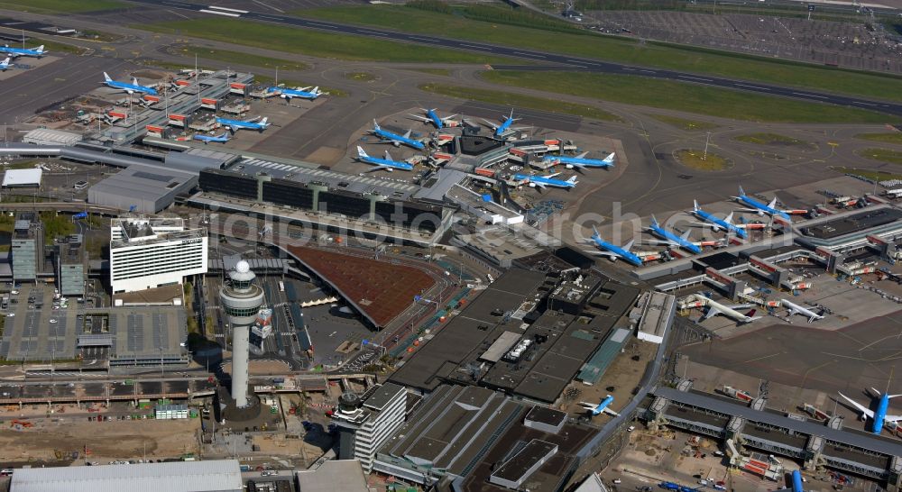 Schiphol from above - Blue passenger aircraft of KLM Royal Dutch Airlines decommissioned at the handling buildings and terminals on the grounds of the airport in Schiphol in Noord-Holland, the Netherlands