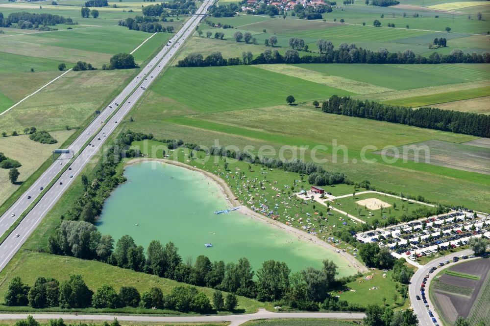 Bergkirchen from above - Mass influx of bathers on the beach and the shore areas of the lake Eisolzrieder See in Bergkirchen in the state Bavaria, Germany