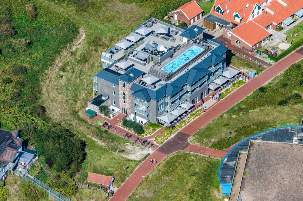 Aerial image Langeoog - Beach hotel Die Sandburg with the swimming pool on the roof and bar on the East Frisian island of Langeoog in the state of Lower Saxony, Germany
