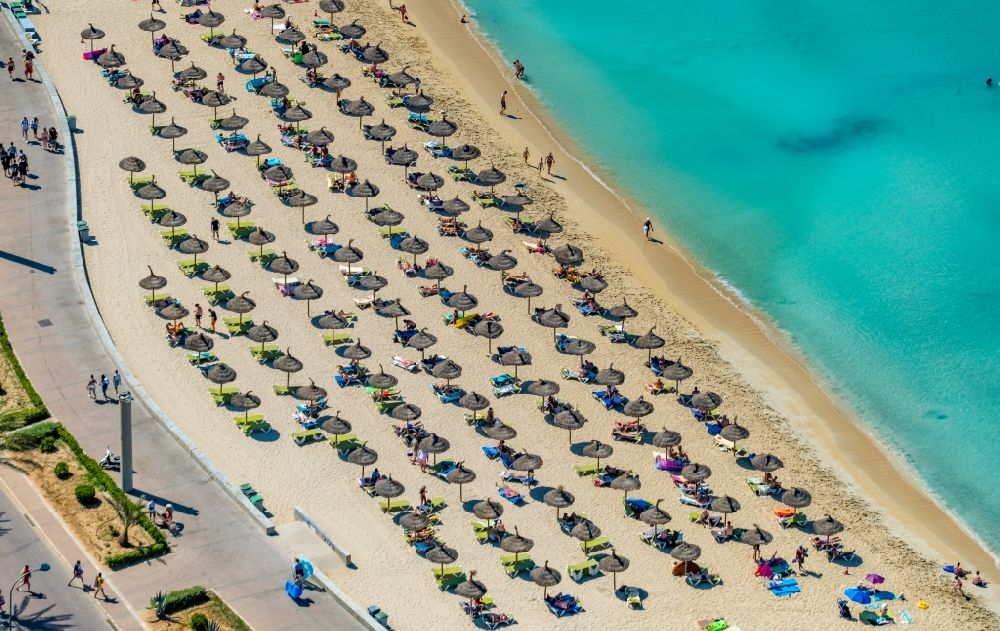 Palma from the bird's eye view: Beach chair on the sandy beach ranks in the coastal area of Ballermann 8 on Carretera de l'Arenal in Palma in Balearic island of Mallorca, Spain