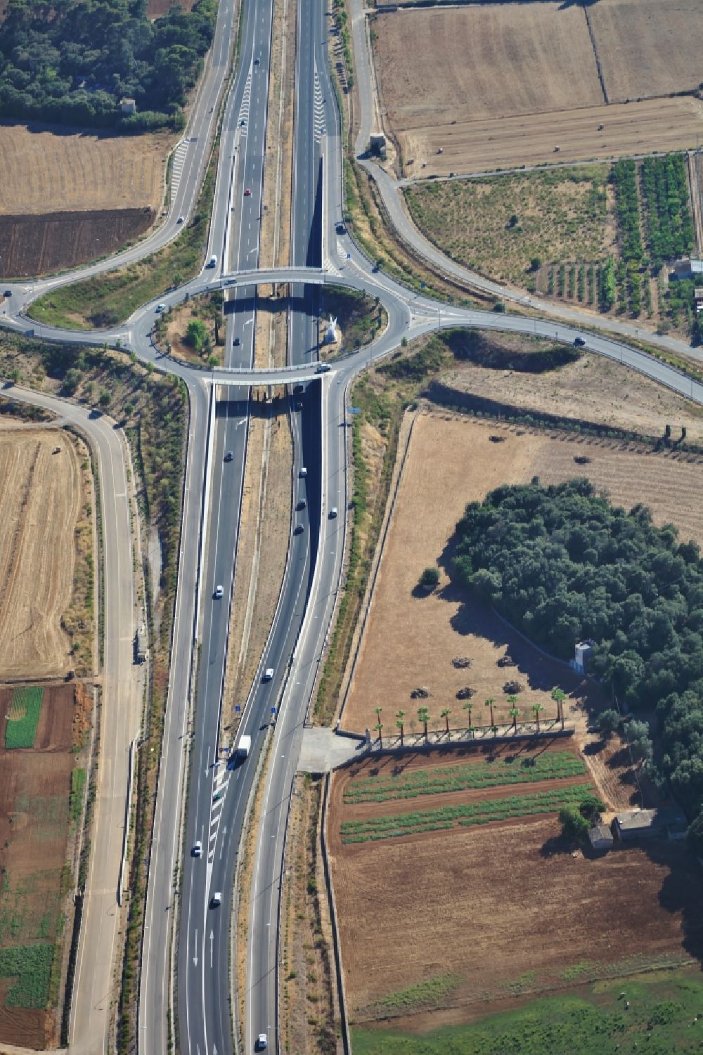 Aerial image Inca - Routing and traffic lanes during the highway exit and access of the motorway M-13 in Inca Mallorca in Islas Baleares, Spain