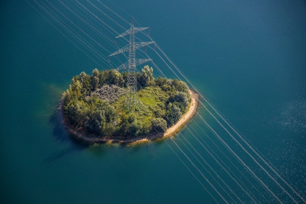 Hünxe from above - Power tower-construction of a road and Interconnector on an island on Tenderingssee in Huenxe in the state North Rhine-Westphalia, Germany