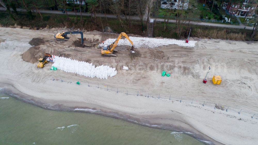 Lubmin from the bird's eye view: Construction site for the construction of a storm surge protection structure in the sandy beach landscape along the coastline of Baltic Sea in Lubmin in the state Mecklenburg - Western Pomerania, Germany