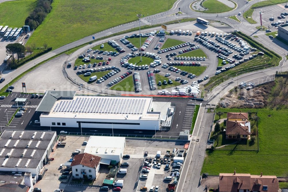Aerial image Spilimbergo - Store of the Supermarket Aldi and round parking place in Spilimbergo in Friuli-Venezia Giulia, Italy