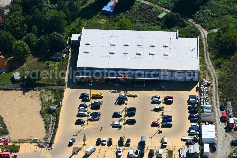 Caputh from above - Store of the Supermarket REWE on street Kirschanger in Caputh in the state Brandenburg, Germany