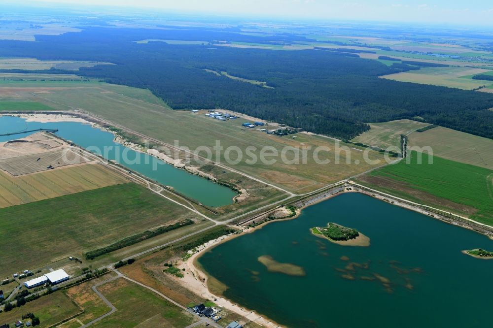 Aerial image Löbnitz - Open pit re cultivation on the shores of the lake Muehlfeldsee and Seelhausener See in Loebnitz in the state Saxony, Germany