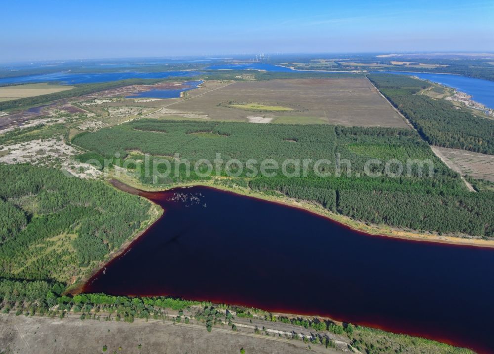 Aerial image Elsterheide - Open pit re cultivation on the shores of the lake Neuwieser See in Elsterheide in the state Saxony, Germany