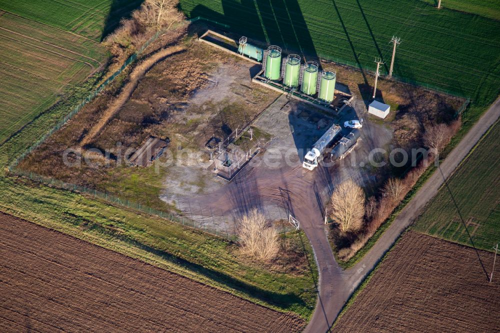 Niederlauterbach from the bird's eye view: Tank and feed pump for oil production and tank-lorries to empty the oil-tanks in the Rhine plain in Niederlauterbach in Grand Est, France