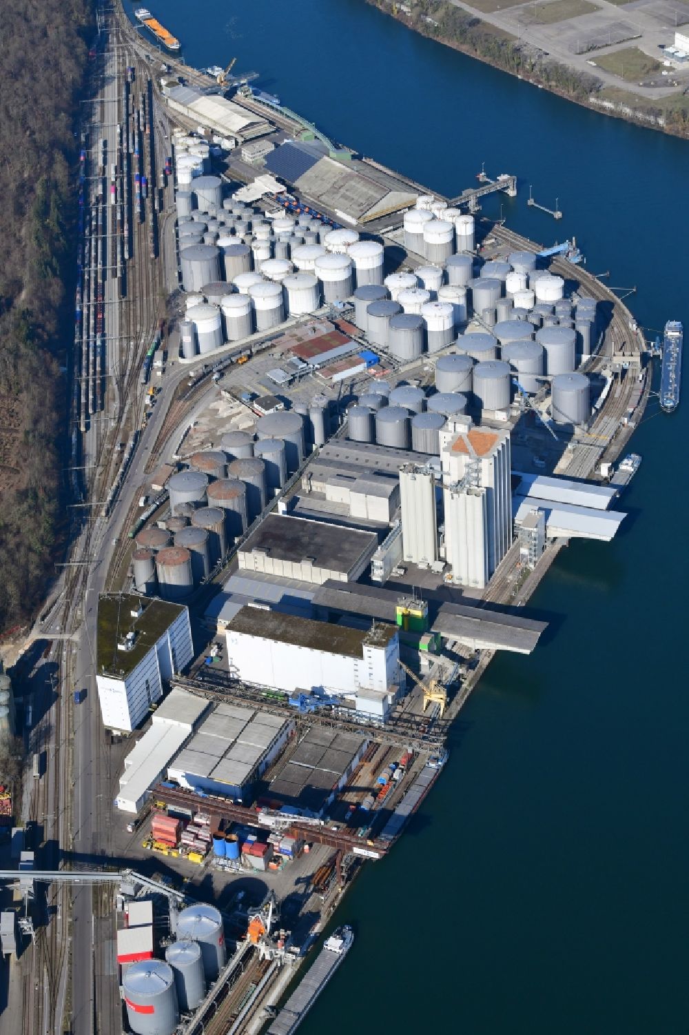 Aerial photograph Muttenz - The tank farm in the Auhafen in Muttenz, Switzerland. The Rhine harbor is turnover for industry and petroleum products