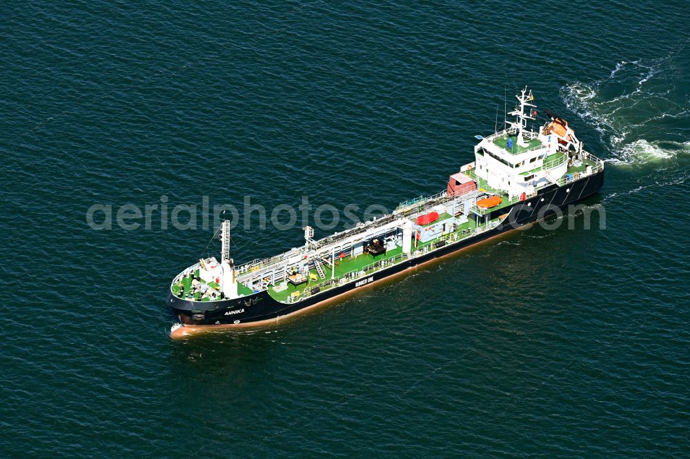 Lübeck from above - Cargo ship - tanker for oil and chemicals Bunker One Annika in motion on the Trave in Luebeck on the Baltic Sea coast in the state Schleswig-Holstein, Germany