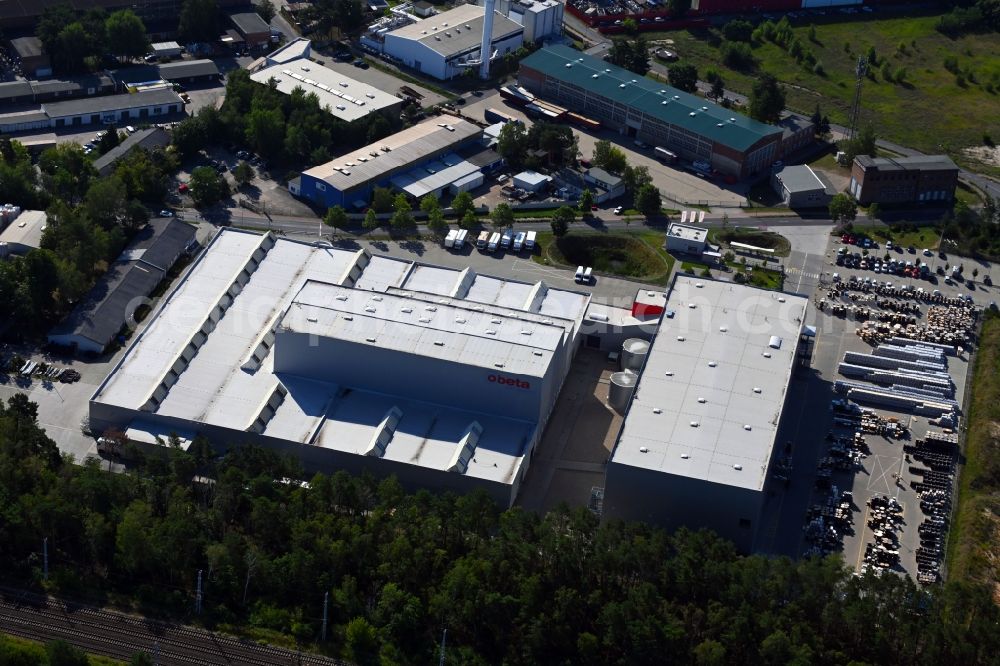 Ludwigsfelde from the bird's eye view: Building complex and distribution center on the site Technilog Technik and Logistik GmbH - Obeta Lager on Gottlieb-Daimler-Strasse in the district Kleinbeeren in Ludwigsfelde in the state Brandenburg, Germany
