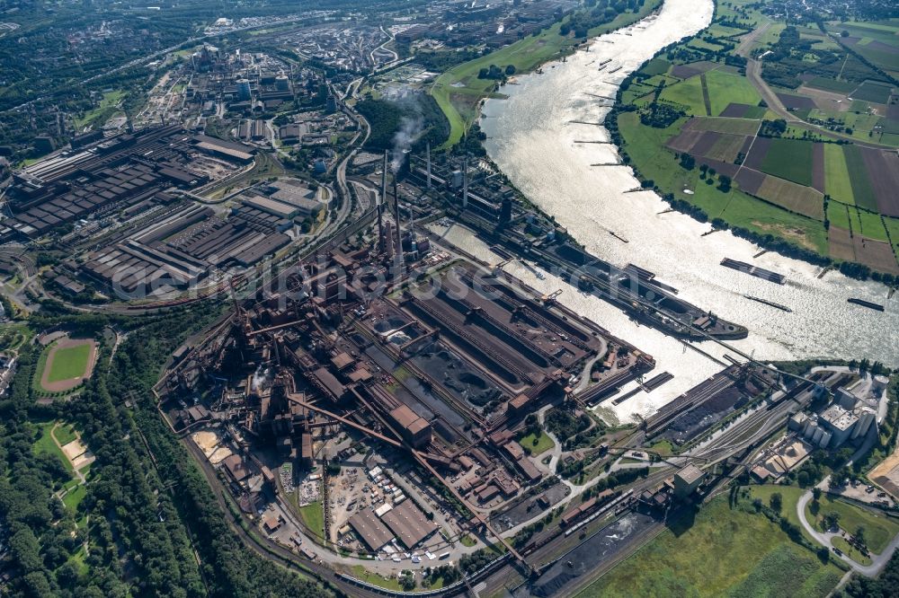 Duisburg from above - Technical equipment and production facilities of the steelworks Schwelgern at the river course of the Rhein in Duisburg at Ruhrgebiet in the state North Rhine-Westphalia, Germany