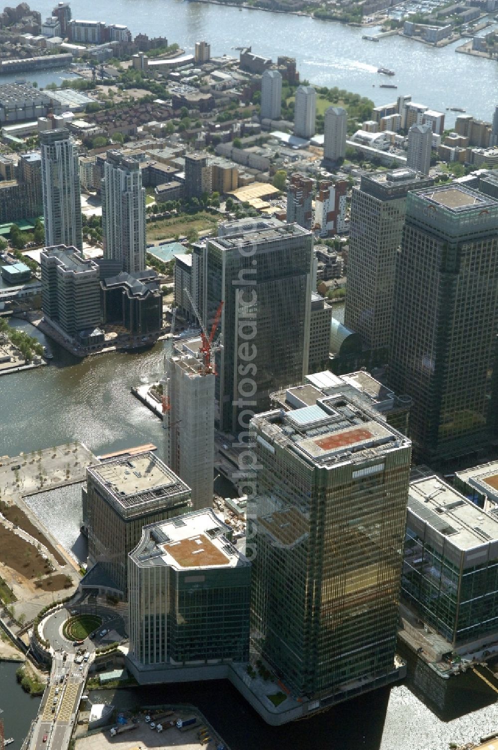 Aerial image Canary Wharf - Partial view of the complex of office buildings Canary Wharf in London. The complex is located on the Isle of Dogs in the borough of London Borough of Tower Hamlets in the heart of the Docklands, the former port area of London. From 1981 on, companies settled there. Today, the construction is used by companies, such as the financial institution HSBC and the media company The Daily Paragraph