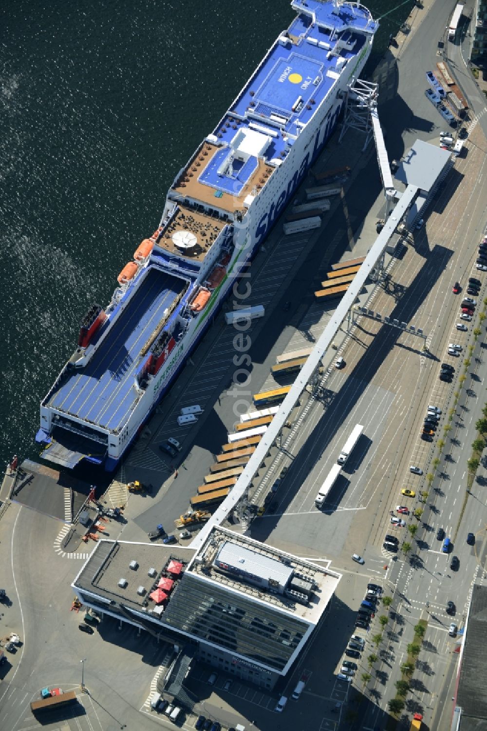 Kiel from above - Terminal building on Schwedenkai and blue ferry of Stena Line in Kiel in the state of Schleswig-Holstein. The architectural distinct building was shaped after a ship and includes offices, a restaurant and a navy terminal