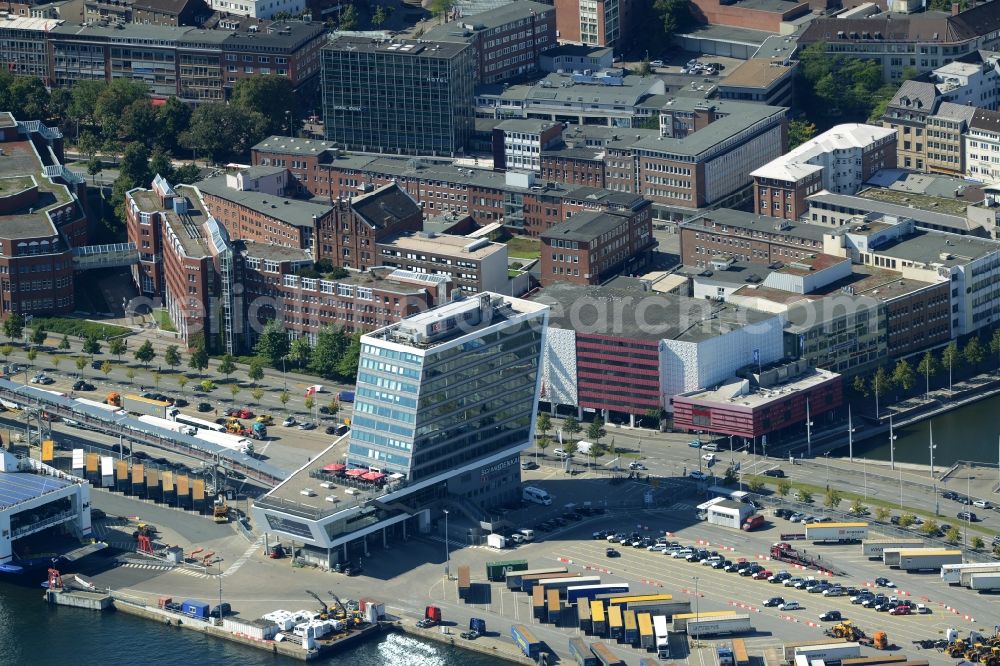 Aerial photograph Kiel - Terminal building on Schwedenkai in Kiel in the state of Schleswig-Holstein. The architectural distinct building was shaped after a ship and includes offices, a restaurant and a navy terminal