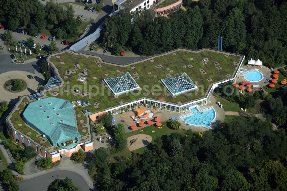 Aerial image Bad Düben - Spa and swimming pools at the swimming pool of the leisure facility Heide Spa in Bad Dueben in the state of Saxony. The architectural distinct building complex with the green roof includes open air pools