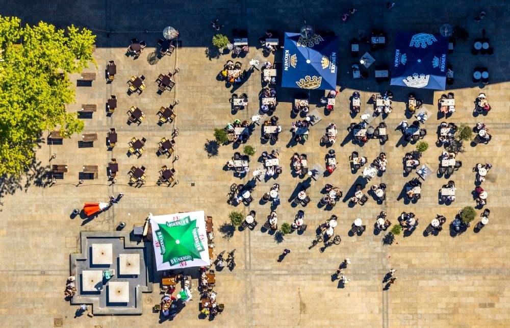 Dortmund from the bird's eye view: Tables and benches of open-air restaurants on Markt in Dortmund in the state North Rhine-Westphalia, Germany