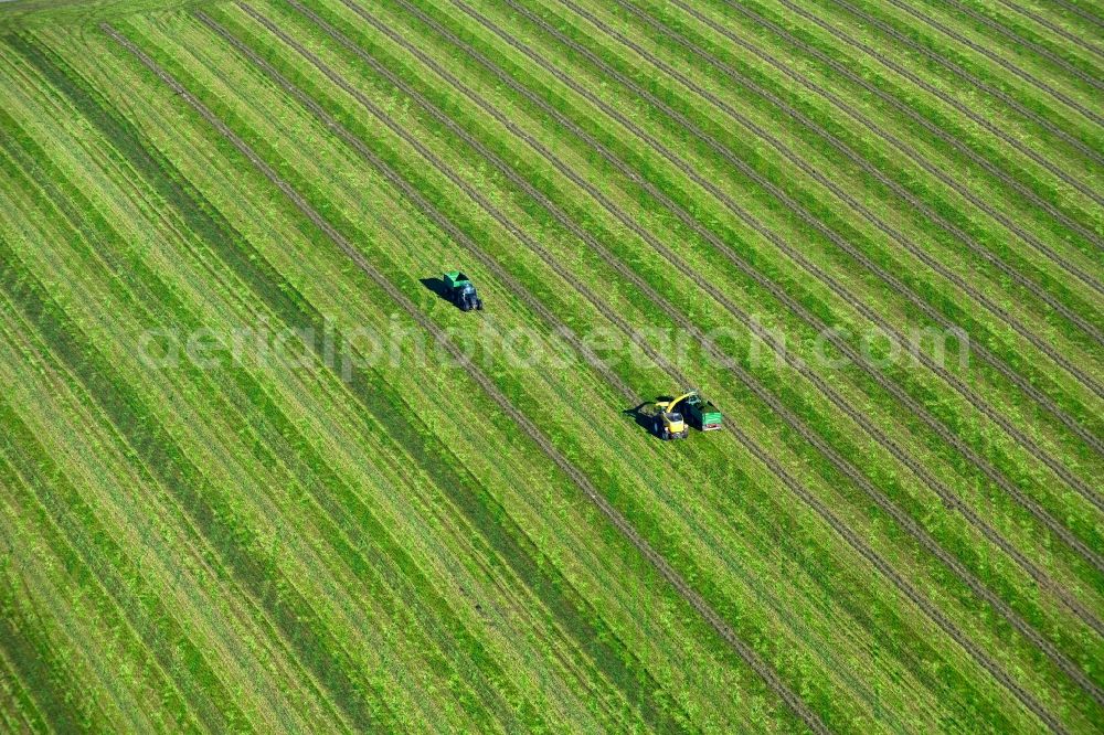 Aerial image Sitten - Transport vehicles in agricultural fields in Sitten in the state Saxony, Germany
