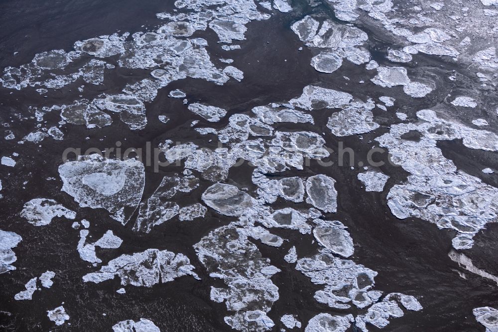 Aerial photograph Friedrichskoog - Ice floe pieces of a drift ice layer on the water surface on the North Sea in Friedrichskoog in the state Schleswig-Holstein, Germany