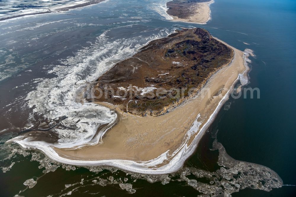 Aerial image Baltrum - Ice floe pieces of a drift ice layer on the water surface vor of Nordsee- Insel Baltrum in the state Lower Saxony, Germany