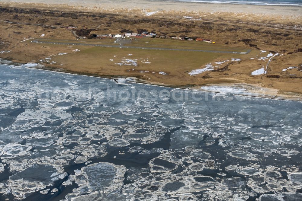 Aerial image Juist - Ice floe pieces of a drift ice layer on the water surface vor of Nordsee- Island Juist in the state Lower Saxony, Germany