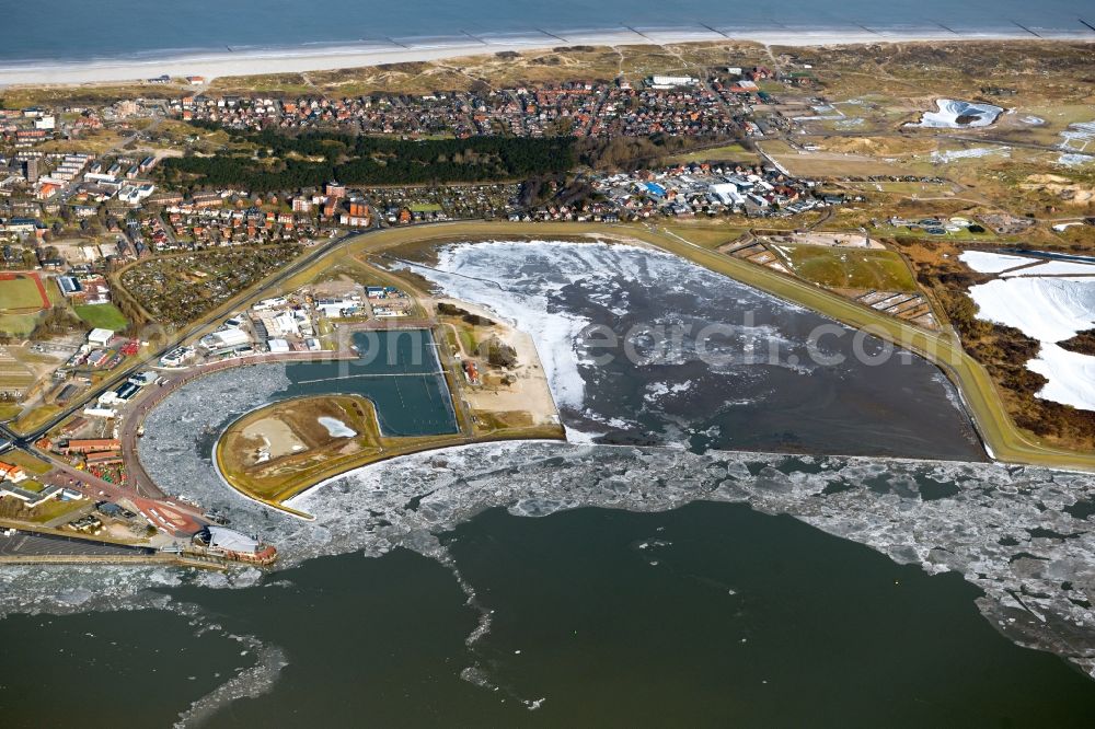 Norderney from above - Ice floe pieces of a drift ice layer on the water surface off the North Sea island of Norderney in the state of Lower Saxony, Germany