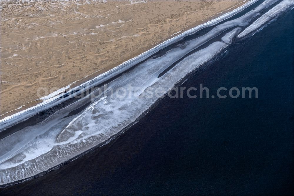 Spiekeroog from above - Ice floe pieces of a drift ice layer on the water surface vor of Nordsee- Insel in Spiekeroog in the state Lower Saxony, Germany