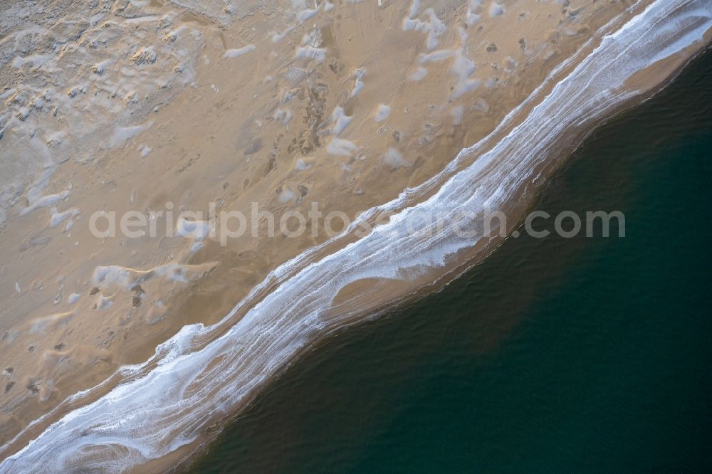 Aerial image Spiekeroog - Ice floe pieces of a drift ice layer on the water surface vor of Nordsee- Insel in Spiekeroog in the state Lower Saxony, Germany