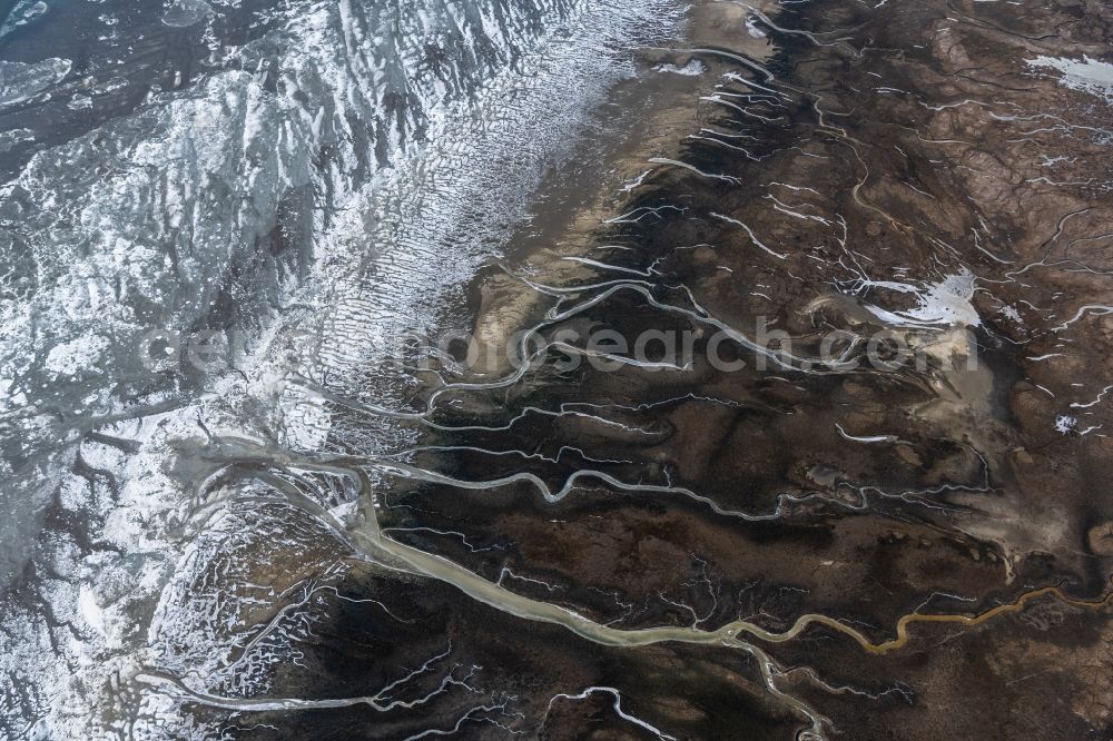 Spiekeroog from the bird's eye view: Ice floe pieces of a drift ice layer on the water surface with Prielenbildung and Maeander vor of Nordsee- Insel in Spiekeroog in the state Lower Saxony, Germany