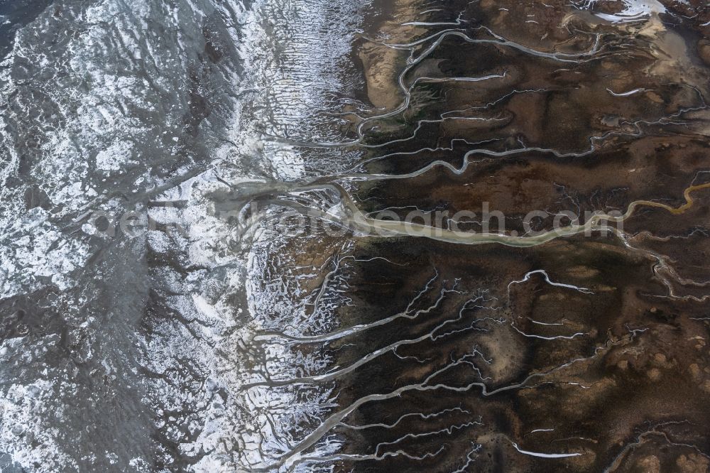 Aerial image Spiekeroog - Ice floe pieces of a drift ice layer on the water surface with Prielenbildung and Maeander vor of Nordsee- Insel in Spiekeroog in the state Lower Saxony, Germany