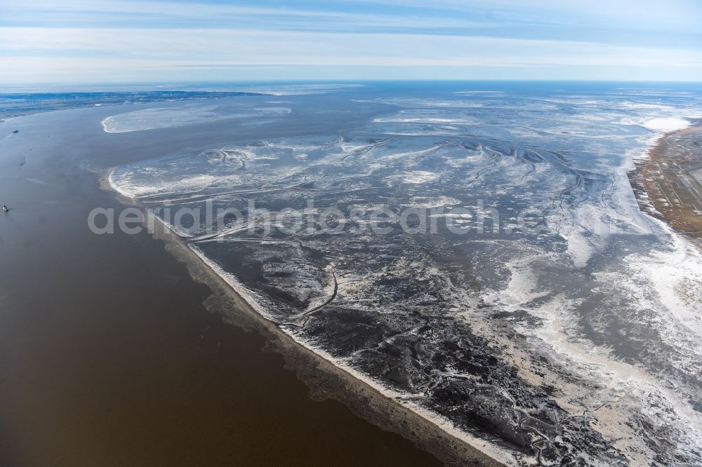 Aerial image Otterndorf - Ice floe pieces of a drift ice layer on the water surface in Wattenmeer on Elbemuendung in Otterndorf in the state Lower Saxony, Germany