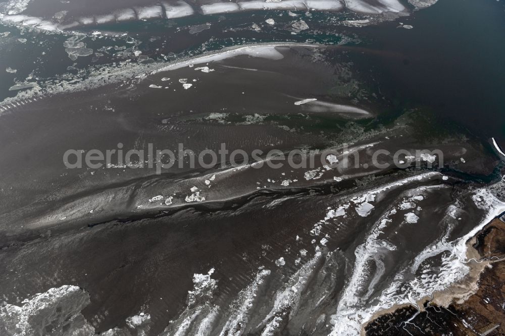 Norderney from the bird's eye view: Ice floe pieces of a drift ice layer on the water surface in Wattenmeer vor of Nordsee- Insel Norderney in the state Lower Saxony, Germany