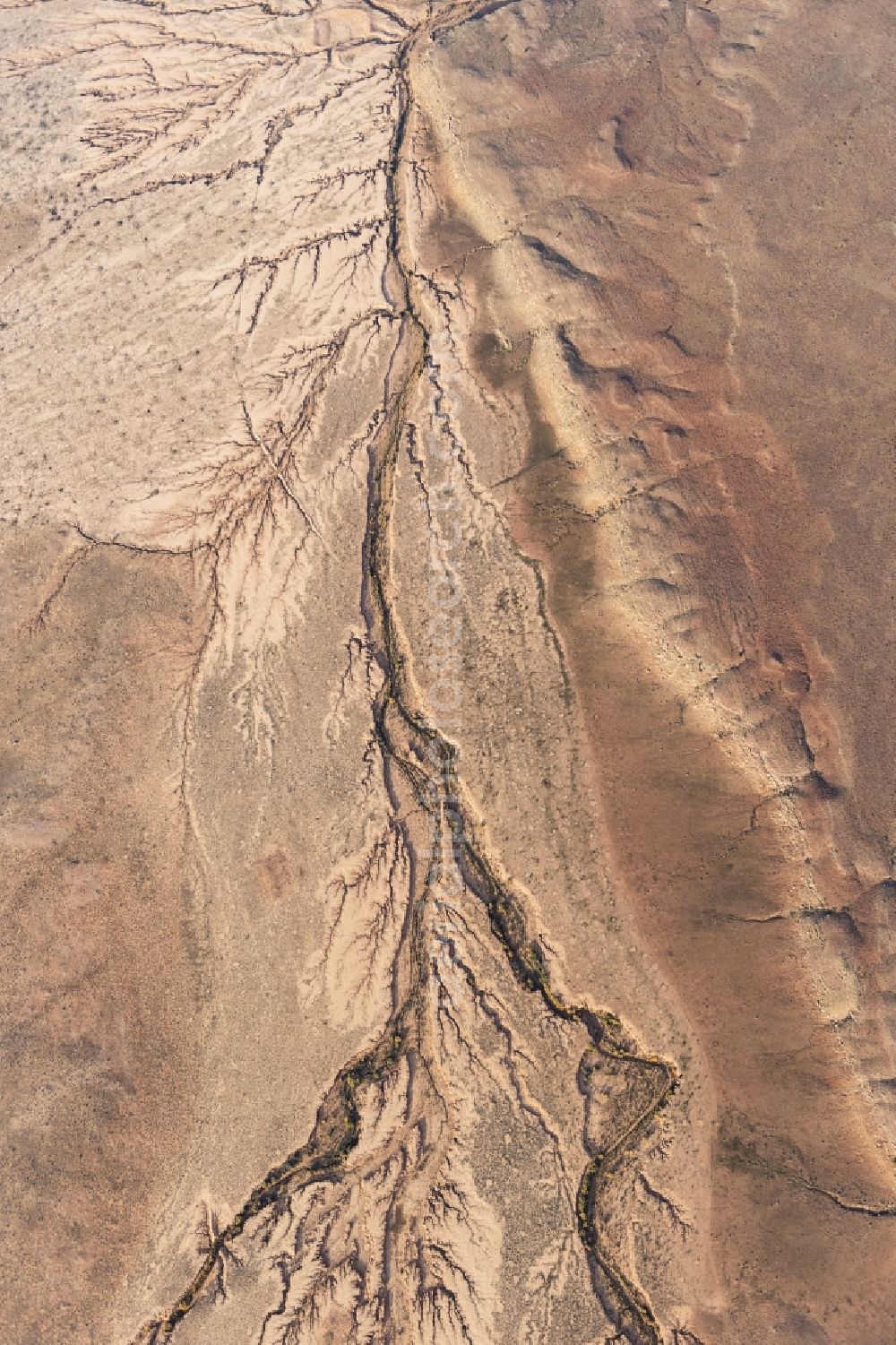 Hackberry from above - Landscape of the dry desert deformed by soil erosion and traces of water in Hackberry in Arizona, United States of America
