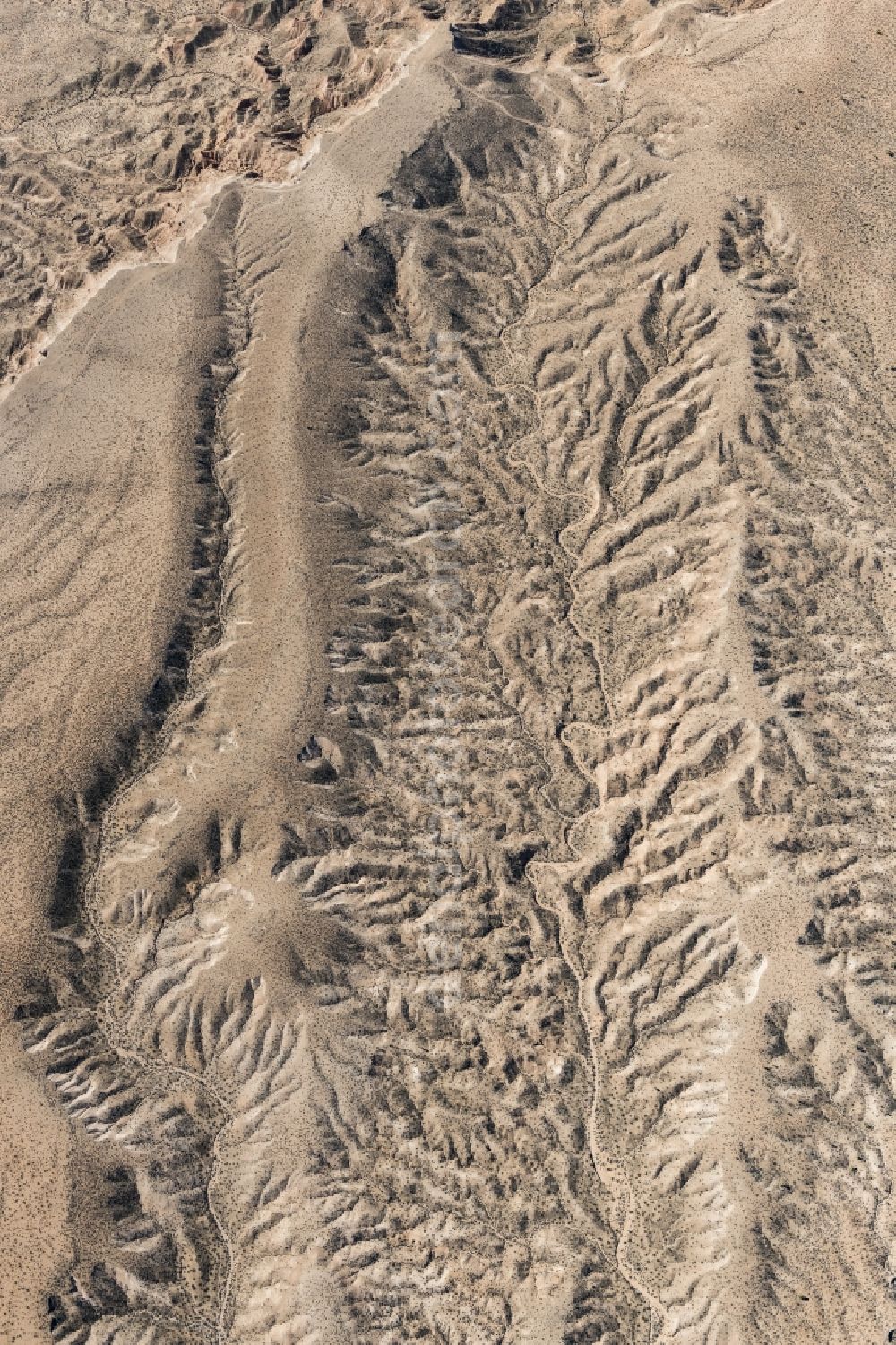 Littlefield from the bird's eye view: Landscape of the dry desert deformed by soil erosion and traces of water in Littlefield in Arizona, United States of America