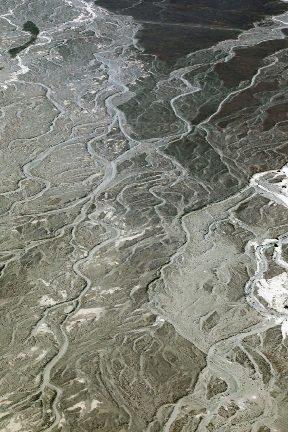 Nazca from above - Landscape of the dry desert deformed by soil erosion and traces of water in Nazca in Ica, Peru