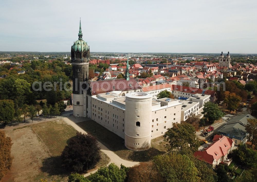 Lutherstadt Wittenberg from the bird's eye view: Castle church of Wittenberg. The castle with high Gothic tower at the west end of the town is a UNESCO World Heritage Site. It gained fame as the Wittenberg Augustinian monk and theology professor Martin Luther spread his disputation