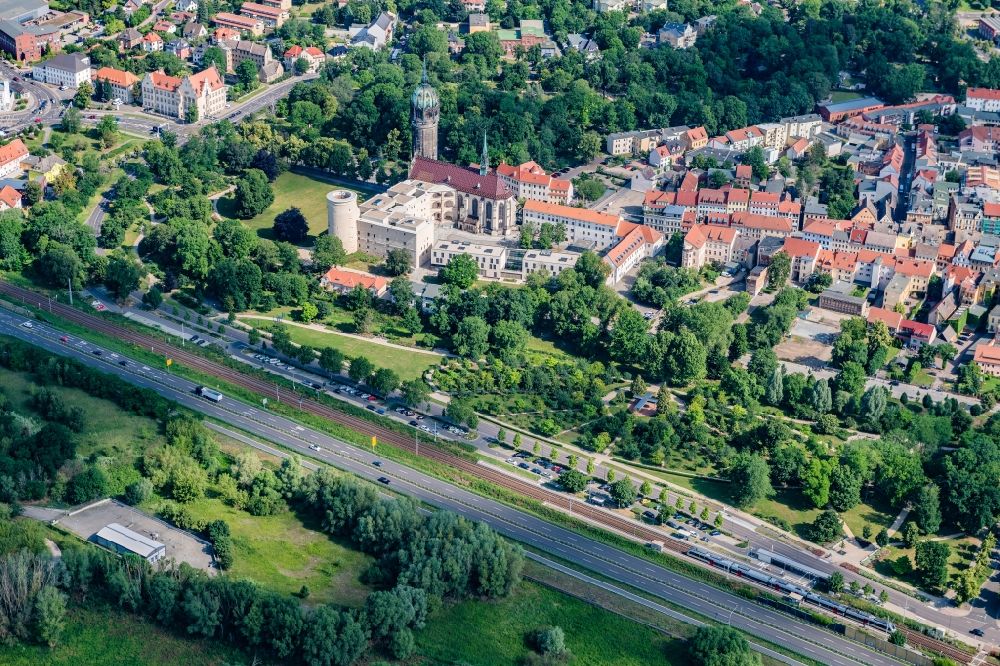 Aerial photograph Lutherstadt Wittenberg - Castle church of Wittenberg. The castle with its 88 m high Gothic tower at the west end of the town is a UNESCO World Heritage Site. It gained fame as the Wittenberg Augustinian monk and theology professor Martin Luther spread his disputation