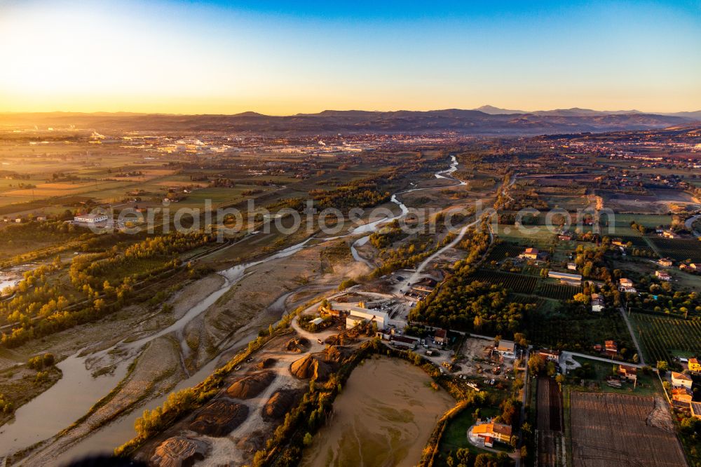 Aerial photograph Salvaterra - Shore areas and riverbed exposed by low-water of the Secchia river at sunrise in Salvaterra in Emilia-Romagna, Italy
