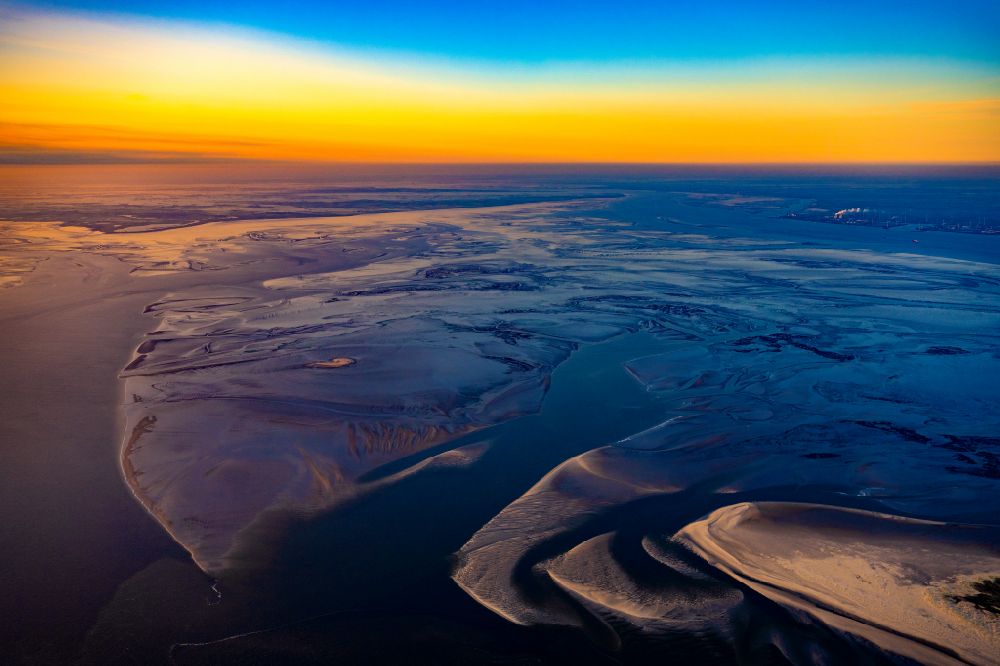 Borkum from the bird's eye view: Shore areas along the river mouth of the Ems into the North Sea at sunrise in front of Borkum in the state of Lower Saxony, Germany