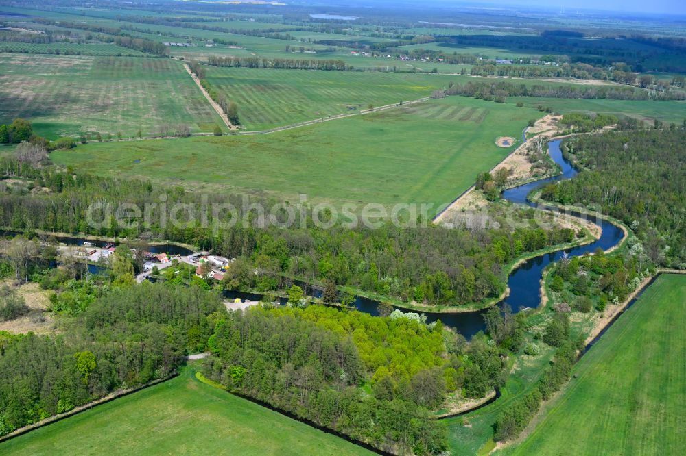 Fehrbellin from the bird's eye view: Riparian zones on the course of the river Alter Rhin in Fehrbellin in the state Brandenburg, Germany