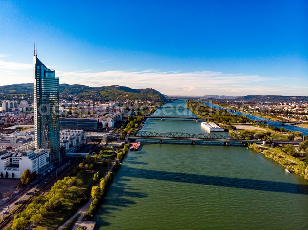 Aerial photograph Wien - Riparian zones on the course of the river der Donau mit Millenium-Tower in Vienna in Austria
