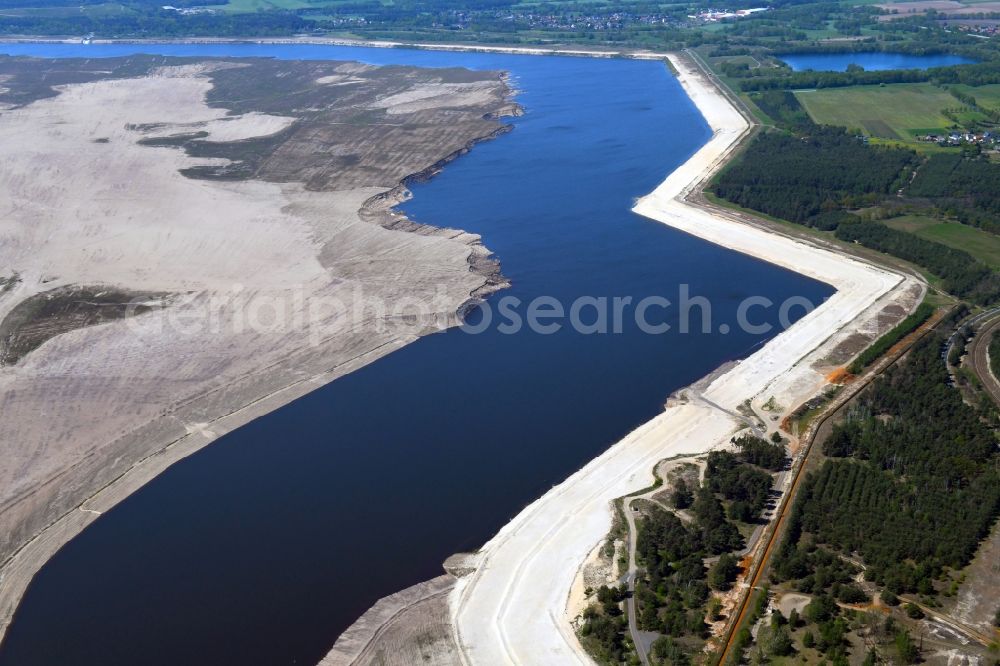 Aerial photograph Teichland - Shore areas of flooded former lignite opencast mine and renaturation lake Cottbuser Ostsee in Teichland in the state Brandenburg, Germany