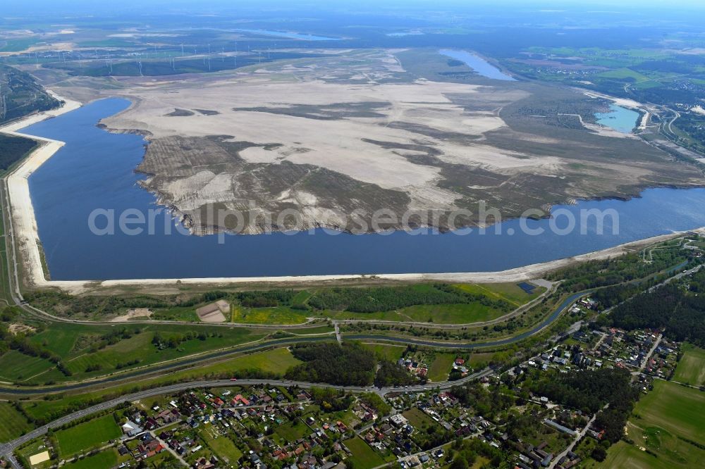 Willmersdorf from above - Shore areas of flooded former lignite opencast mine and renaturation lake Cottbuser Ostsee in Willmersdorf in the state Brandenburg, Germany
