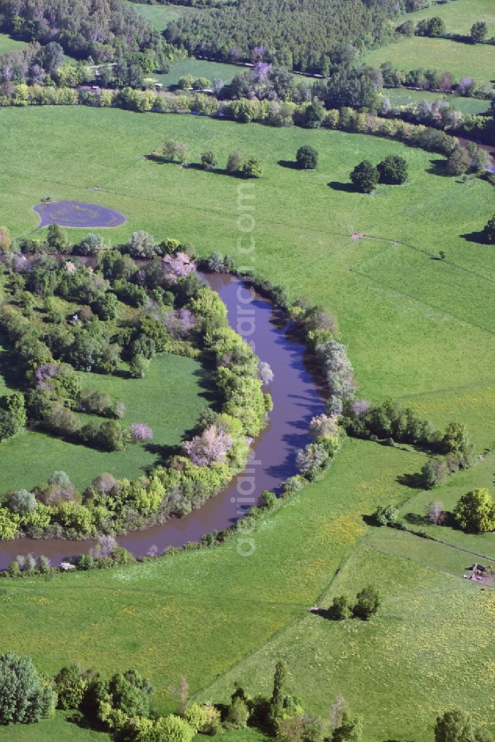 Saint-Denis-de-Pile from the bird's eye view: Curved loop of the riparian zones on the course of the river Isle in Saint-Denis-de-Pile in Aquitaine Limousin Poitou-Charentes, France