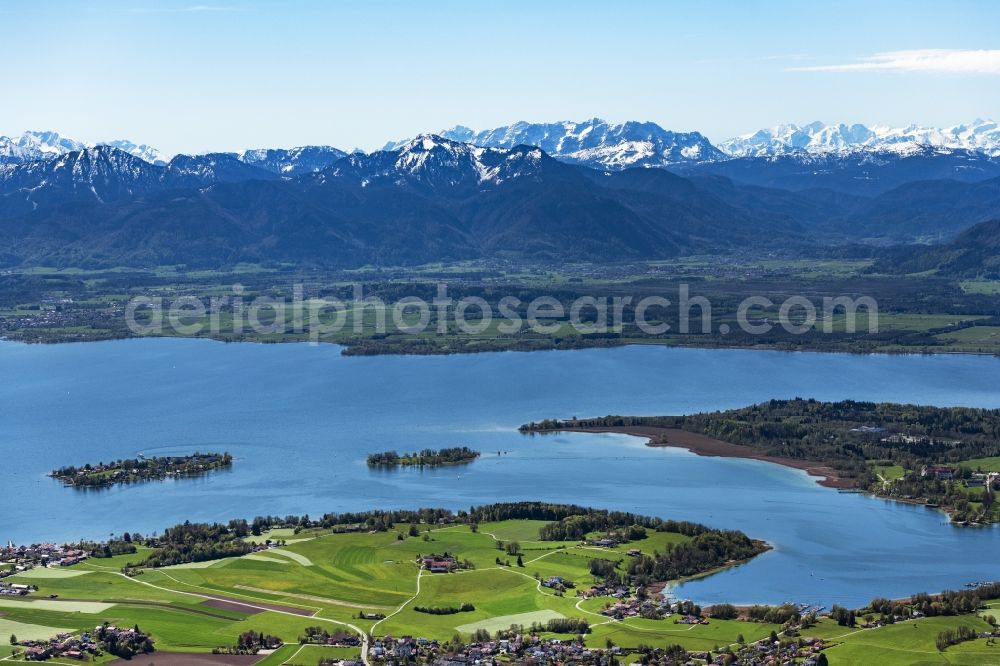 Breitbrunn am Chiemsee from above - Riparian areas on the lake area of Chiemsee with Blick auf die Herreninsel in Breitbrunn am Chiemsee in the state Bavaria, Germany