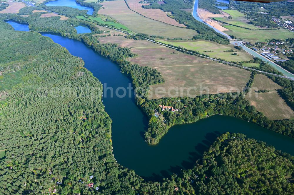 Werbellin from above - Riparian areas on the lake area of Uedersee in a forest area in Werbellin at Schorfheide in the state Brandenburg, Germany