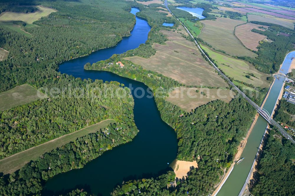Werbellin from above - Riparian areas on the lake area of Uedersee in a forest area in Werbellin at Schorfheide in the state Brandenburg, Germany