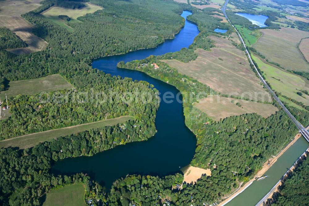 Werbellin from the bird's eye view: Riparian areas on the lake area of Uedersee in a forest area in Werbellin at Schorfheide in the state Brandenburg, Germany